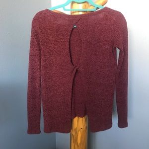 Maroon sweater, open back.